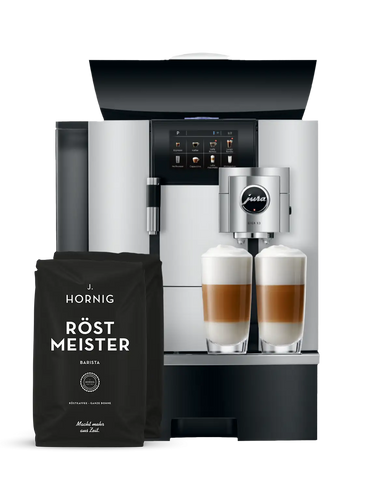 Eine silberne Jura Kaffeemaschine mit zwei Packungen J. Hornig Röstmeister